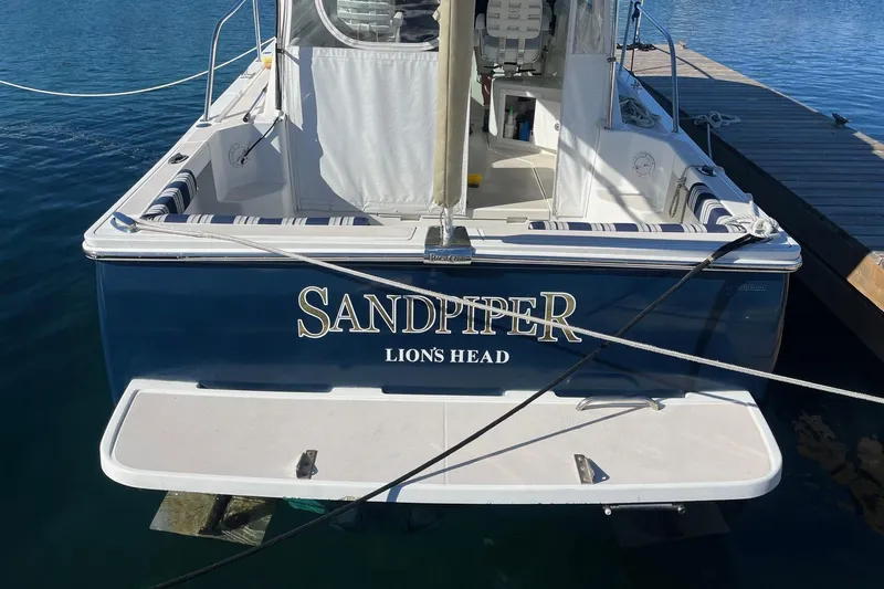 Sandpiper Yacht Photos Pics 2008 Back Cove 29 boat named "Sandpiper" docked at a marina.