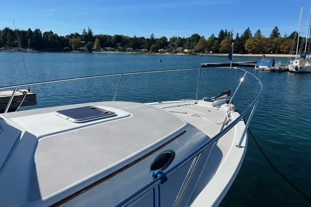 Sandpiper Yacht Photos Pics 2008 Back Cove 29 boat docked on a serene lake with clear blue skies.