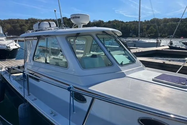 Sandpiper Yacht Photos Pics 2008 Back Cove 29 boat docked at marina, featuring sleek design and spacious cabin.