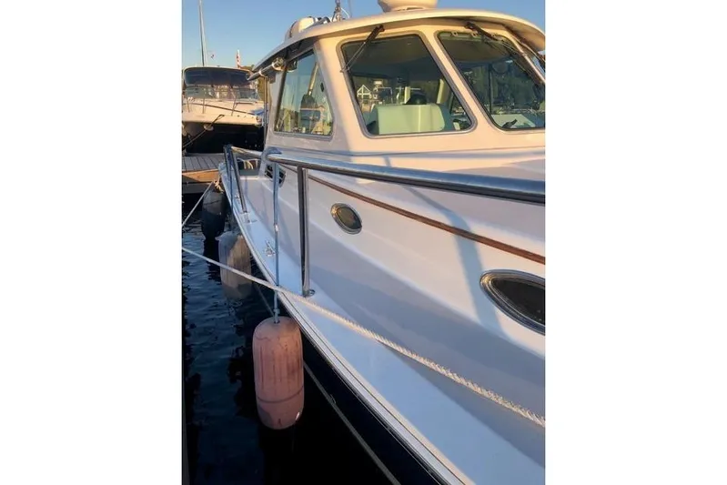 Sandpiper Yacht Photos Pics 2008 Back Cove 29 boat docked, featuring sleek design and polished railings.