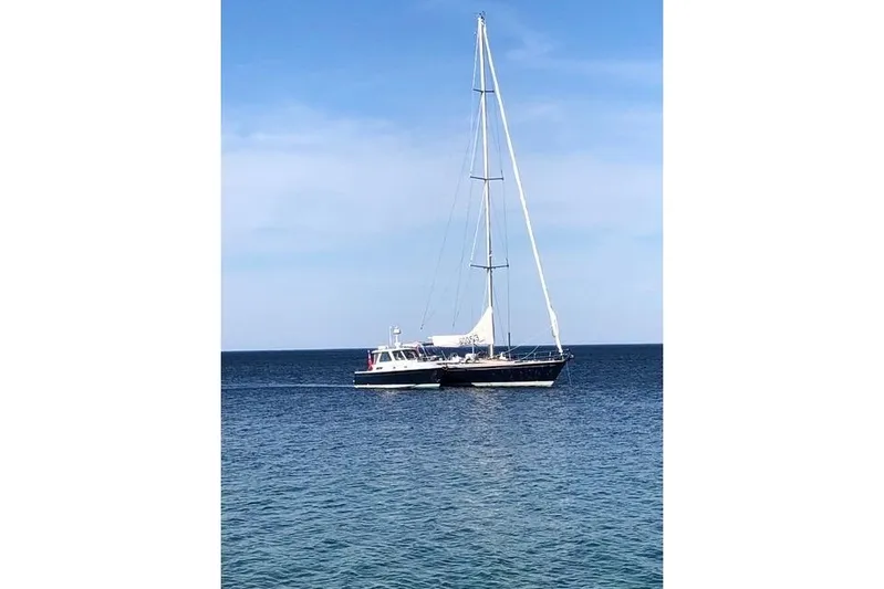 Sandpiper Yacht Photos Pics 2008 Back Cove 29 boat sailing on calm blue ocean under clear sky.