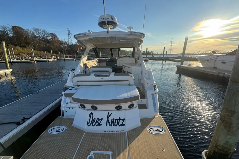  Yacht Photos Pics 2017 Regal 35 Sport Coupe yacht docked at marina during sunset.