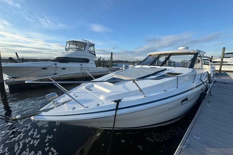  Yacht Photos Pics 2017 Regal 35 Sport Coupe docked at marina under clear blue sky.