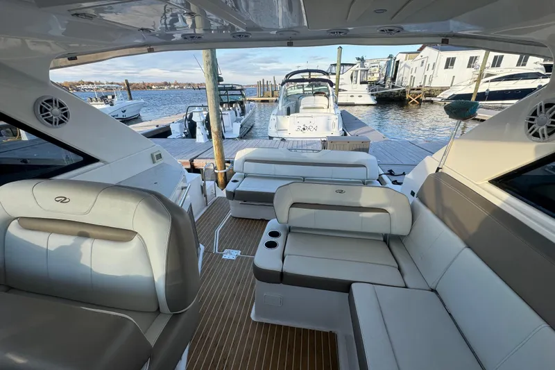  Yacht Photos Pics Interior view of 2017 Regal 35 Sport Coupe yacht at a marina dock.