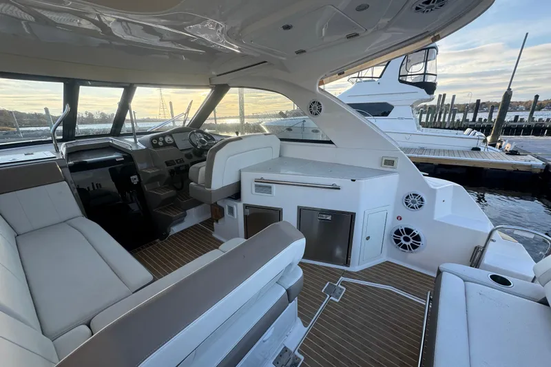  Yacht Photos Pics 2017 Regal 35 Sport Coupe interior with luxurious seating and modern dashboard at marina.