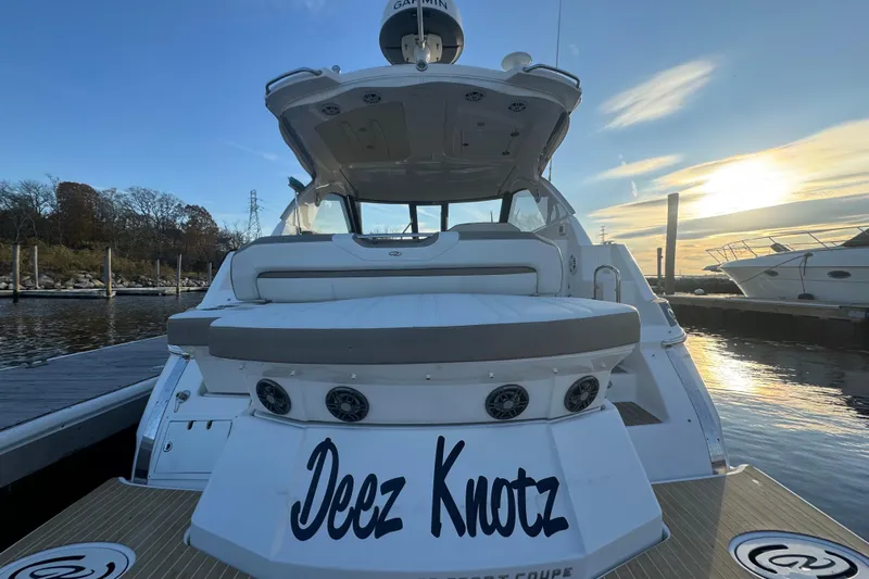  Yacht Photos Pics 2017 Regal 35 Sport Coupe yacht docked at sunset, rear view.