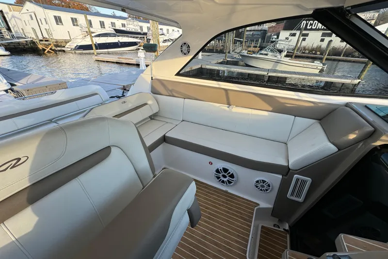  Yacht Photos Pics Interior of 2017 Regal 35 Sport Coupe with luxurious seating and waterfront view.