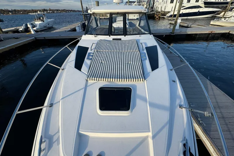  Yacht Photos Pics 2017 Regal 35 Sport Coupe docked at marina, showcasing sleek design and spacious deck.