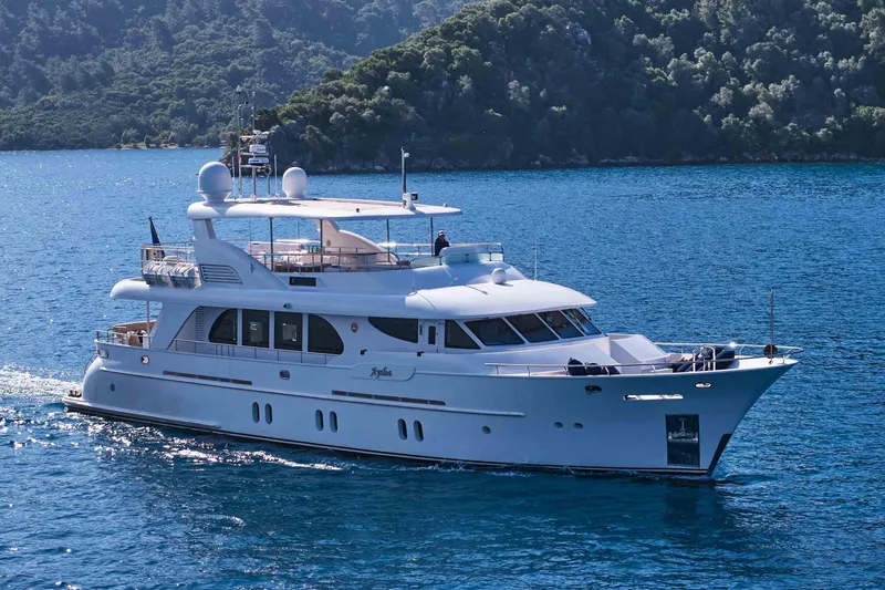 Aysha Yacht Photos Pics Luxurious 2012 Timmerman 26 yacht cruising on serene blue waters.