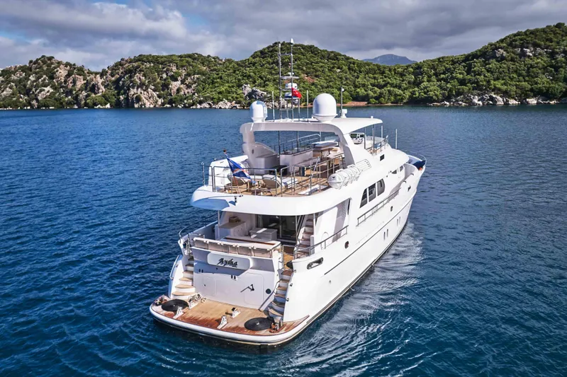 Aysha Yacht Photos Pics Luxurious 2012 Timmerman 26 yacht cruising in scenic coastal waters.