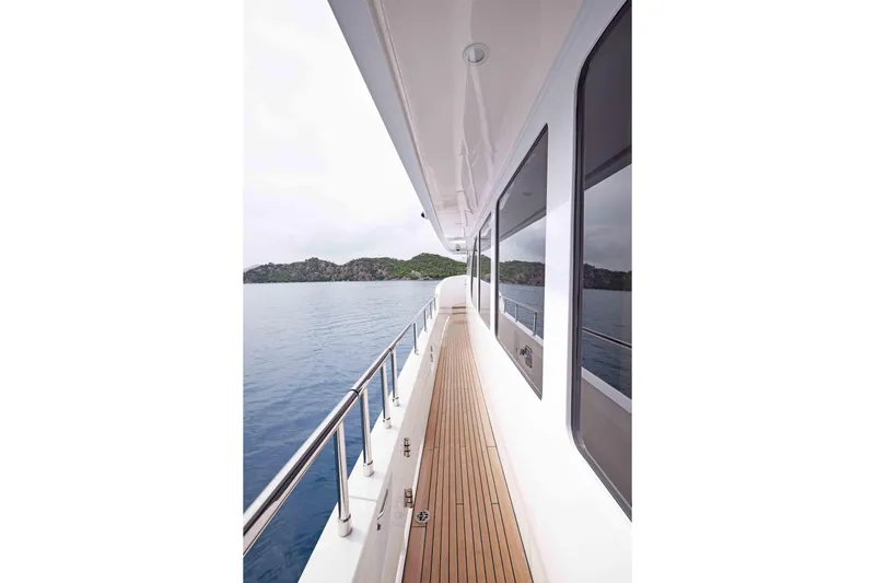 Aysha Yacht Photos Pics Side deck of 2012 Timmerman 26 yacht with ocean and island view.