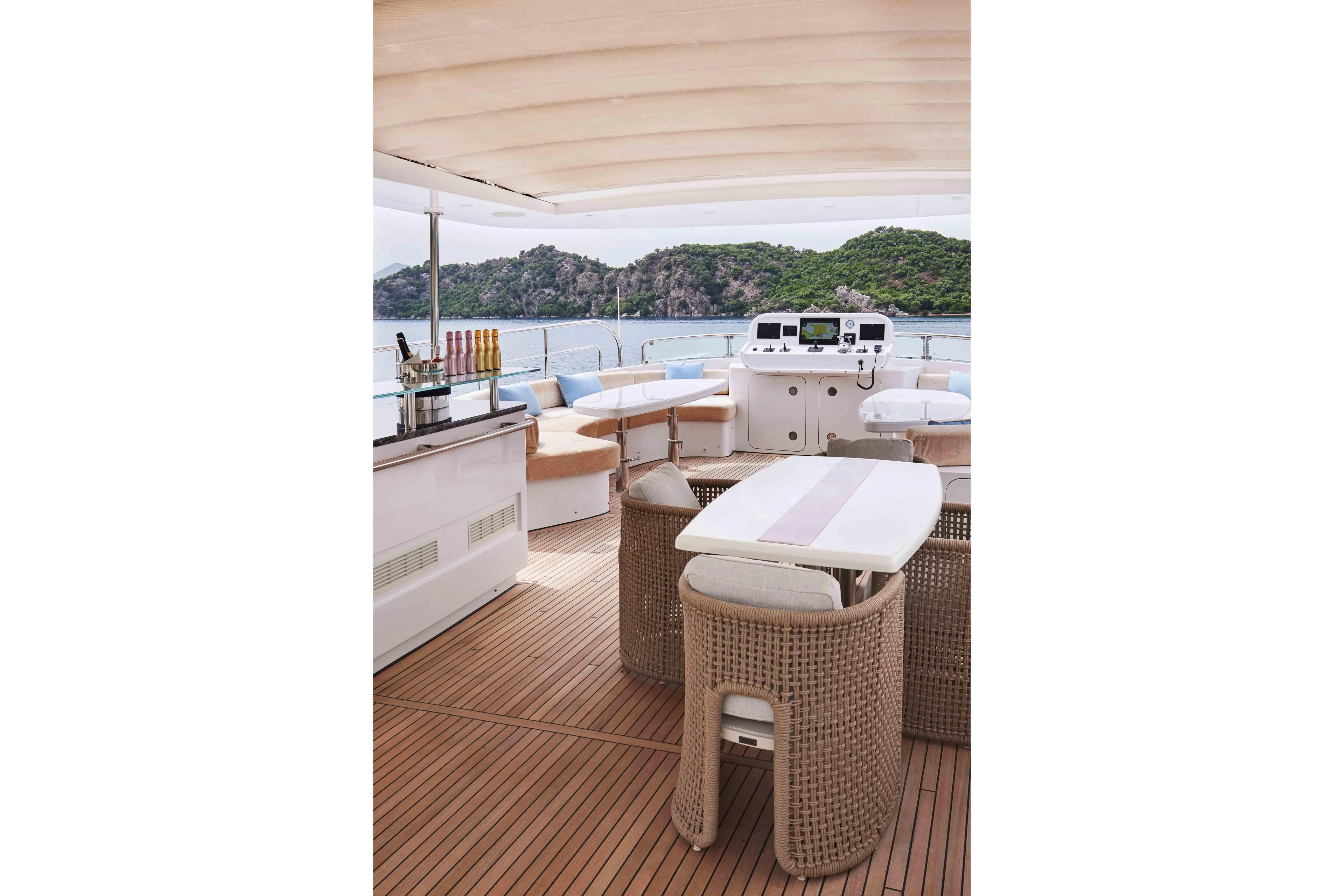Aysha Yacht Photos Pics Luxurious Timmerman 26 yacht deck with seating, bar, and scenic ocean view, 2012 model.