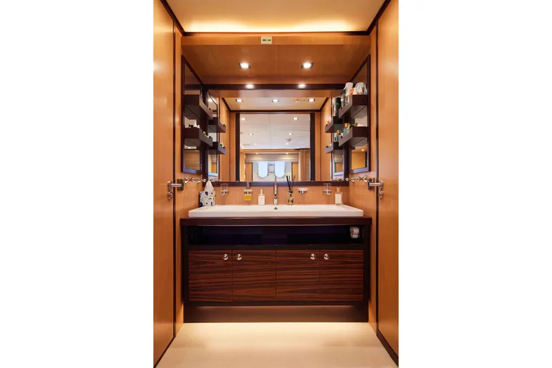 Aysha Yacht Photos Pics Luxurious bathroom interior on 2012 Timmerman 26 yacht, featuring modern fixtures and elegant wood finishes.