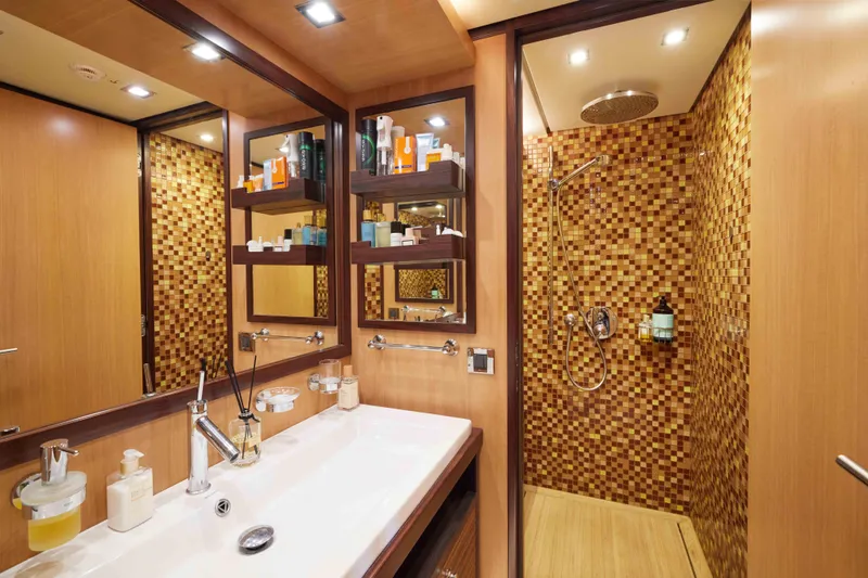 Aysha Yacht Photos Pics Luxurious yacht bathroom with mosaic tiles, modern fixtures, and ample storage. Timmerman 26, 2012 model.