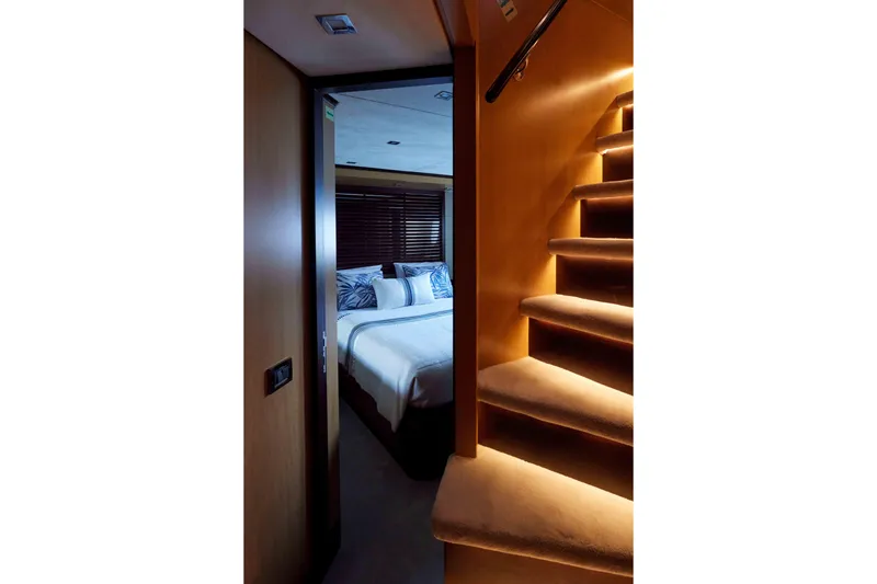 Aysha Yacht Photos Pics Luxurious bedroom and staircase inside a 2012 Timmerman 26 yacht.