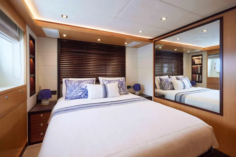 Aysha Yacht Photos Pics Luxurious bedroom interior on 2012 Timmerman 26 yacht, featuring elegant decor and modern lighting.