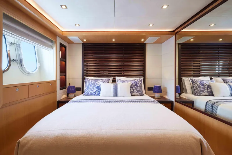 Aysha Yacht Photos Pics Luxurious bedroom interior on 2012 Timmerman 26 yacht with elegant decor and ambient lighting.