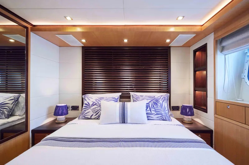 Aysha Yacht Photos Pics Luxurious Timmerman 26 yacht bedroom interior, 2012 model, featuring elegant decor and ambient lighting.