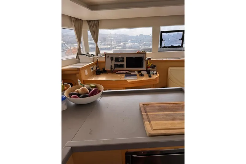 Honu Yacht Photos Pics Interior of 2015 Lagoon 450 F yacht with kitchen and navigation area.