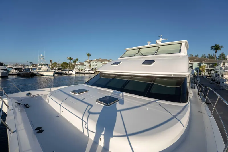 Sea Dreamz Yacht Photos Pics 2016 Horizon PC52 yacht docked at marina under clear blue sky.