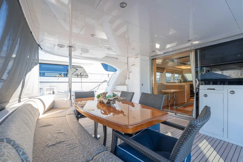 Sea Dreamz Yacht Photos Pics Luxurious 2016 Horizon PC52 yacht interior with elegant dining area and modern furnishings.