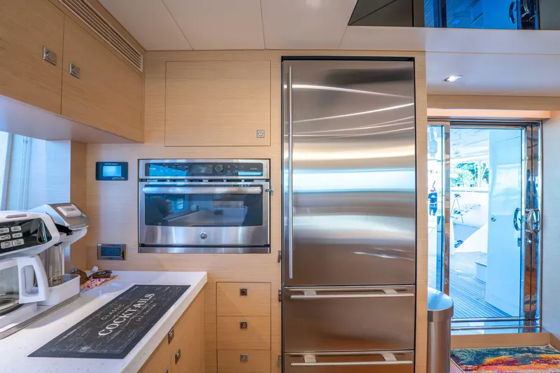 Sea Dreamz Yacht Photos Pics Modern kitchen on 2016 Horizon PC52 yacht with stainless steel appliances and sleek design.