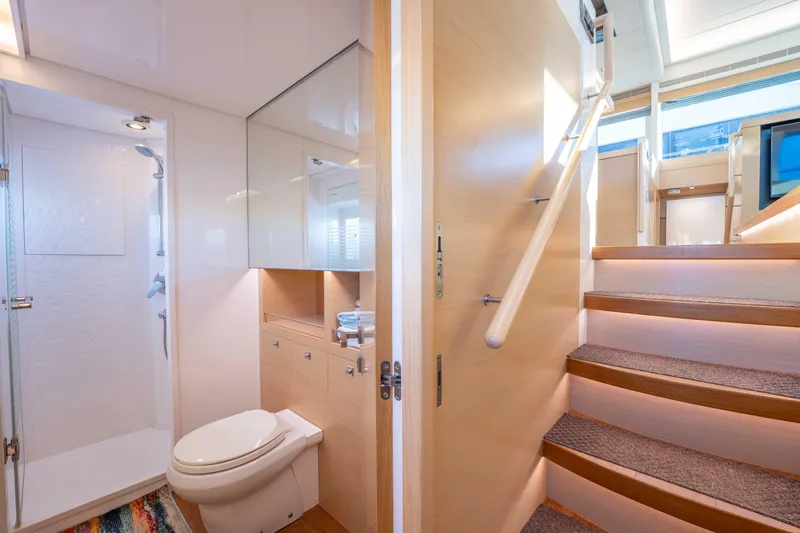 Sea Dreamz Yacht Photos Pics Luxurious bathroom and staircase in 2016 Horizon PC52 yacht interior.