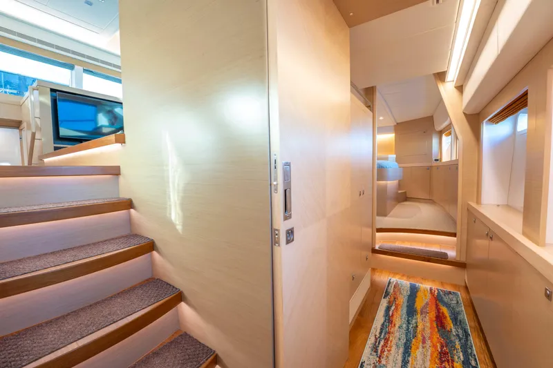 Sea Dreamz Yacht Photos Pics Luxurious interior of 2016 Horizon PC52 yacht with modern design and vibrant rug.