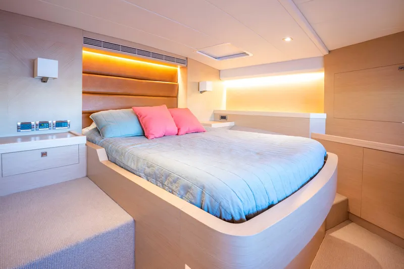 Sea Dreamz Yacht Photos Pics Luxurious bedroom interior of 2016 Horizon PC52 yacht with modern design and ambient lighting.