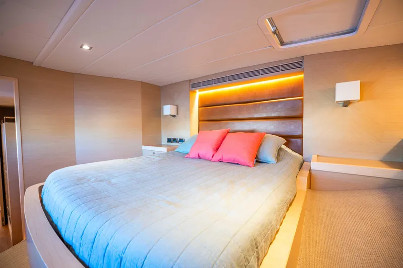 Sea Dreamz Yacht Photos Pics Luxurious bedroom interior on 2016 Horizon PC52 yacht with modern lighting and cozy bedding.