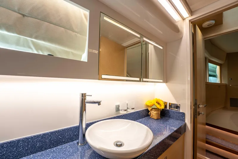 Sea Dreamz Yacht Photos Pics Luxurious bathroom in 2016 Horizon PC52 yacht with modern sink and sunflowers.