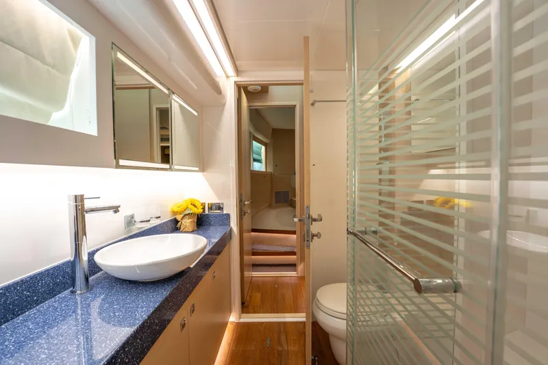Sea Dreamz Yacht Photos Pics Luxurious bathroom interior of 2016 Horizon PC52 yacht with modern fixtures and elegant design.