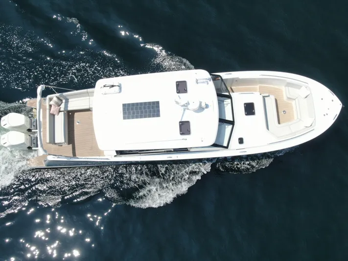 Artemis Yacht Photos Pics Aerial view of 2023 MJM 4 yacht cruising on open water.