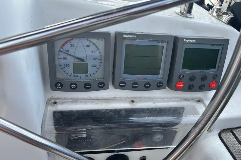 Summer Solace Yacht Photos Pics Control panel of a 2000 Jeanneau Sun Odyssey 40 sailboat with Raytheon instruments.