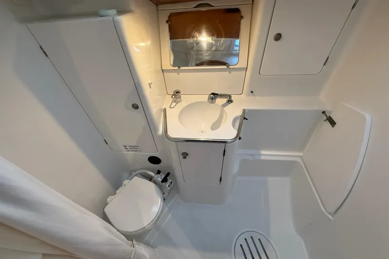 Summer Solace Yacht Photos Pics Bathroom interior of 2000 Jeanneau Sun Odyssey 40 yacht, featuring sink and toilet.