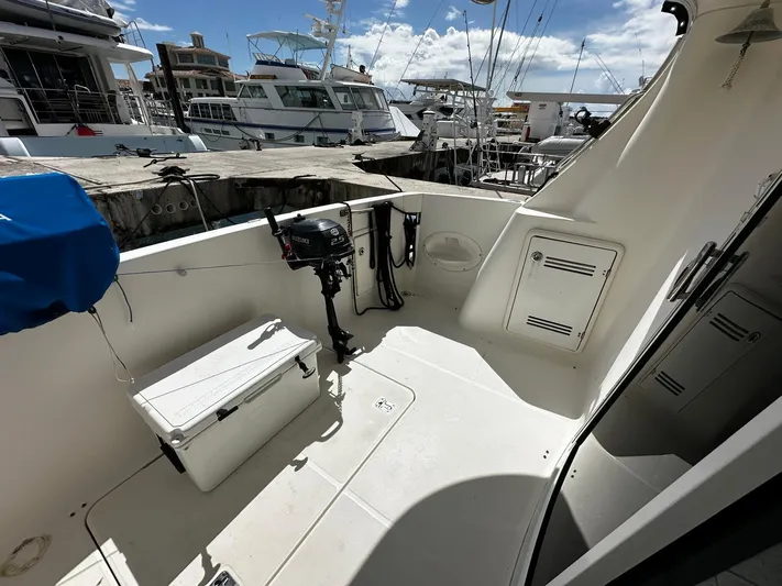 Yacht Photos Pics 2006 Silverton 43 Sport Bridge yacht deck with storage and equipment, docked at marina.