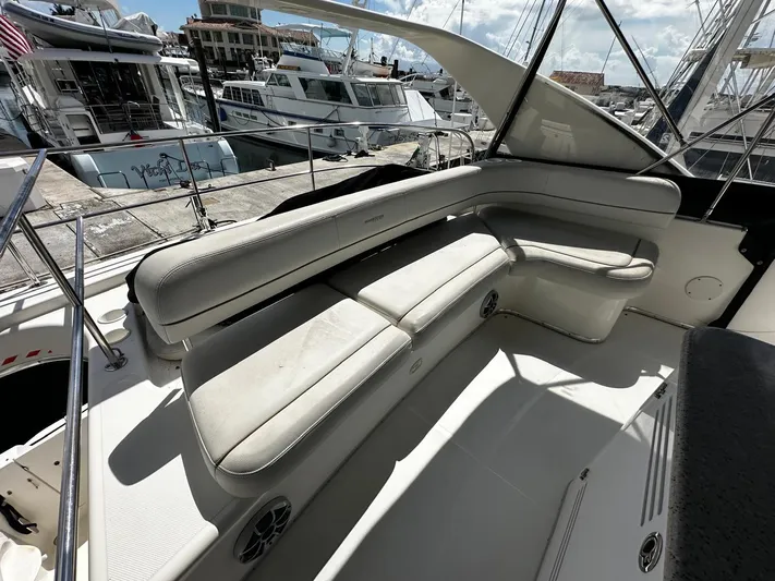  Yacht Photos Pics 2006 Silverton 43 Sport Bridge yacht with spacious seating at a marina.