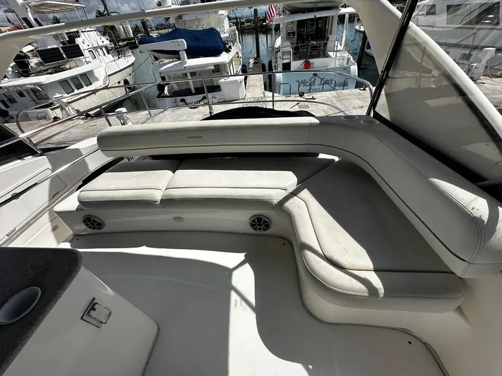  Yacht Photos Pics 2006 Silverton 43 Sport Bridge yacht with spacious seating area and marina view.