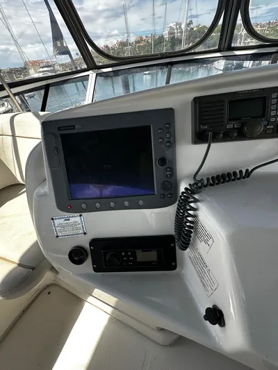  Yacht Photos Pics 2006 Silverton 43 Sport Bridge helm with navigation equipment and controls.