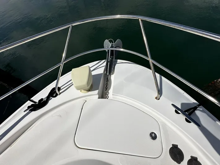  Yacht Photos Pics Bow of 2006 Silverton 43 Sport Bridge yacht with anchor and railing.