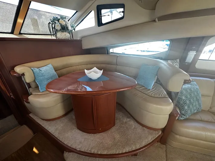  Yacht Photos Pics Luxurious interior of 2006 Silverton 43 Sport Bridge yacht with elegant seating and decor.