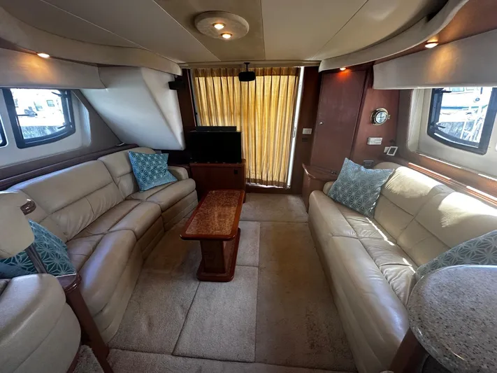  Yacht Photos Pics Luxurious interior of 2006 Silverton 43 Sport Bridge yacht with leather seating and elegant decor.