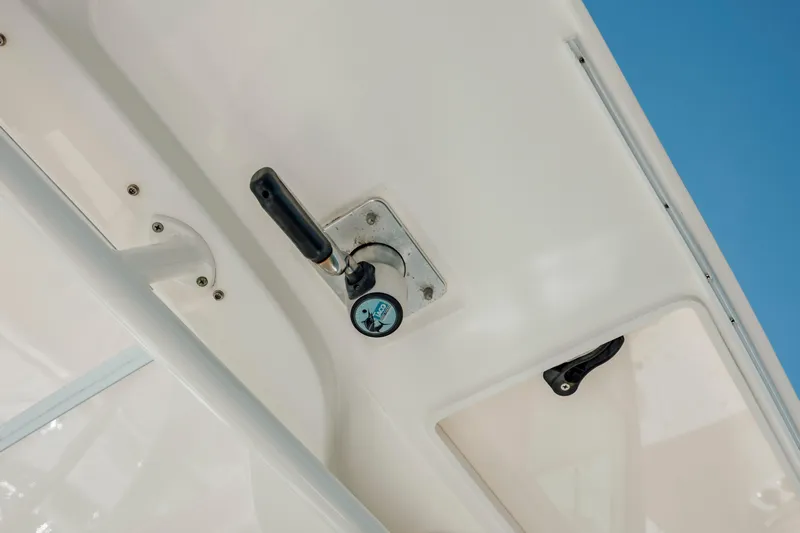  Yacht Photos Pics 2013 Boston Whaler 320 Outrage boat detail, featuring a handle and latch mechanism.