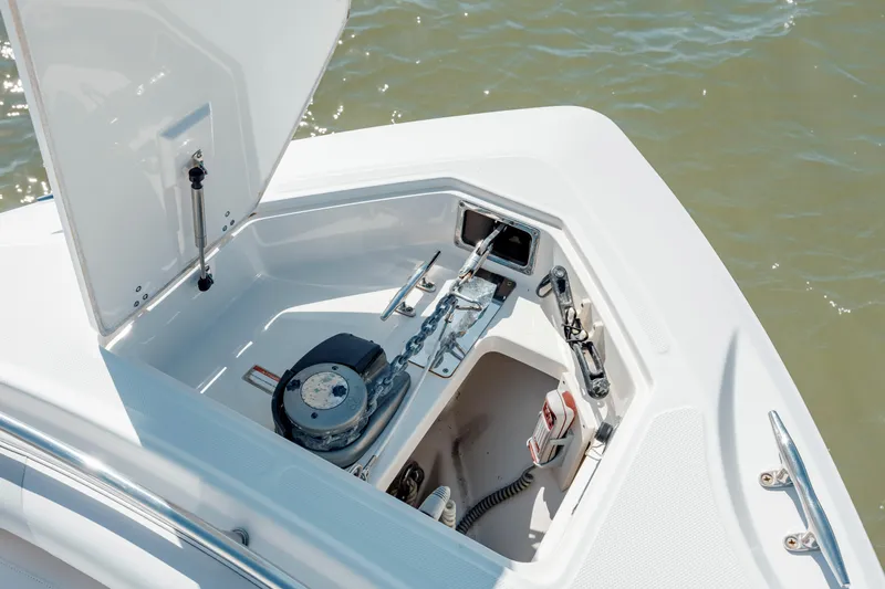  Yacht Photos Pics 2013 Boston Whaler 320 Outrage anchor compartment with winch and storage.