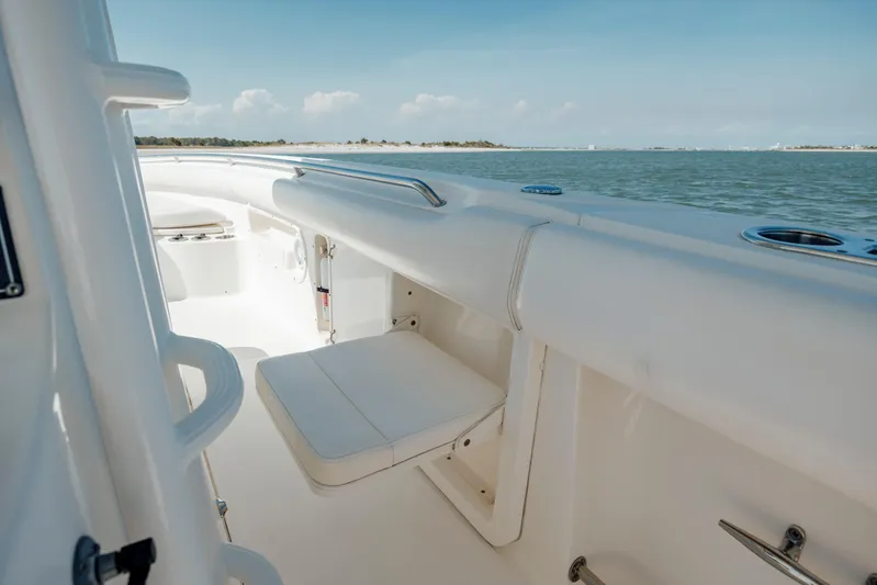  Yacht Photos Pics 2013 Boston Whaler 320 Outrage boat interior with seating, ocean view.
