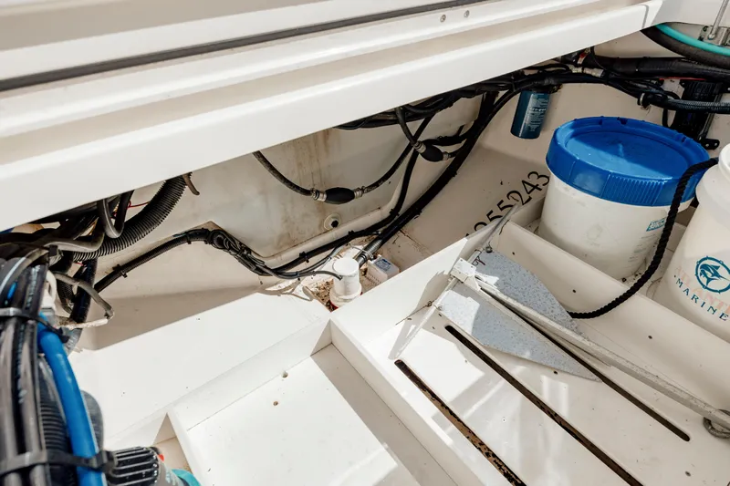  Yacht Photos Pics 2013 Boston Whaler 320 Outrage interior showing wiring and storage compartment.