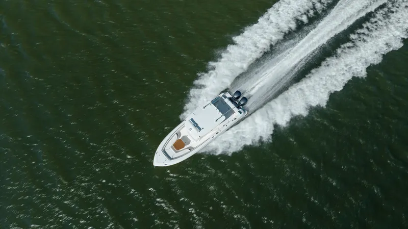  Yacht Photos Pics Aerial view of 2013 Boston Whaler 320 Outrage speeding on open water.