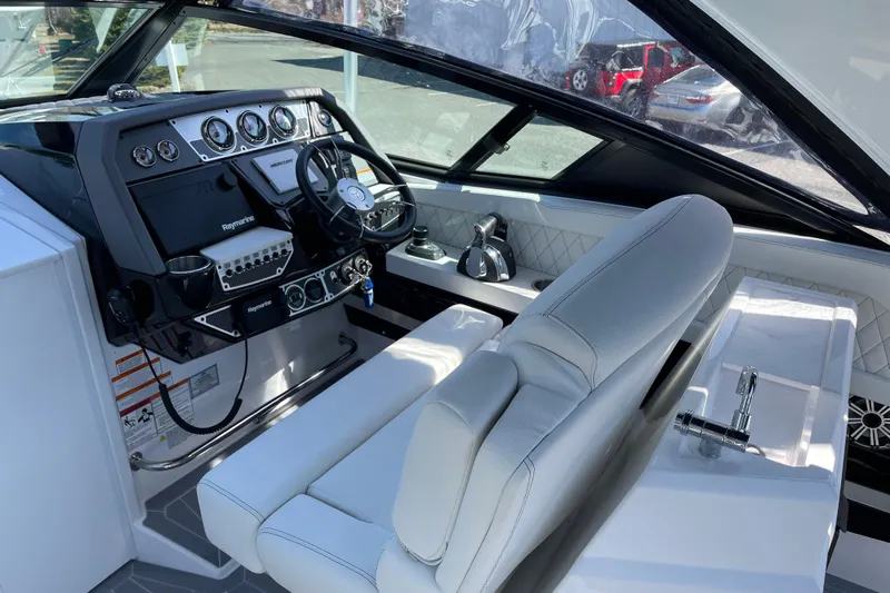  Yacht Photos Pics 2021 Cruisers Yachts 338 Outboard helm with modern controls and luxurious seating.