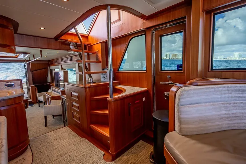 Sunny Seajay Yacht Photos Pics Luxurious interior of 2022 Hampton 658l Endurance yacht with wooden finishes and ocean view.
