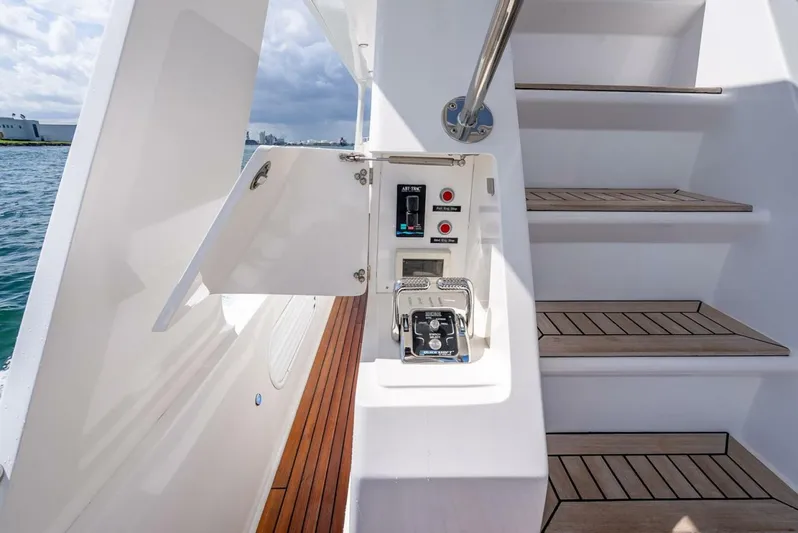 Sunny Seajay Yacht Photos Pics Staircase and control panel on 2022 Hampton 658l Endurance yacht deck.